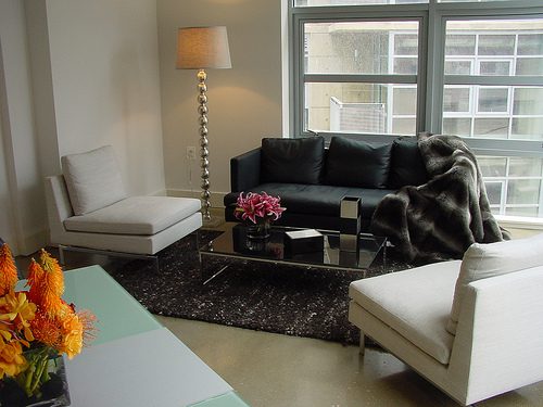 living room with sofa and flowers