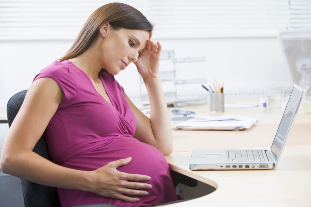 Pregnant woman working 