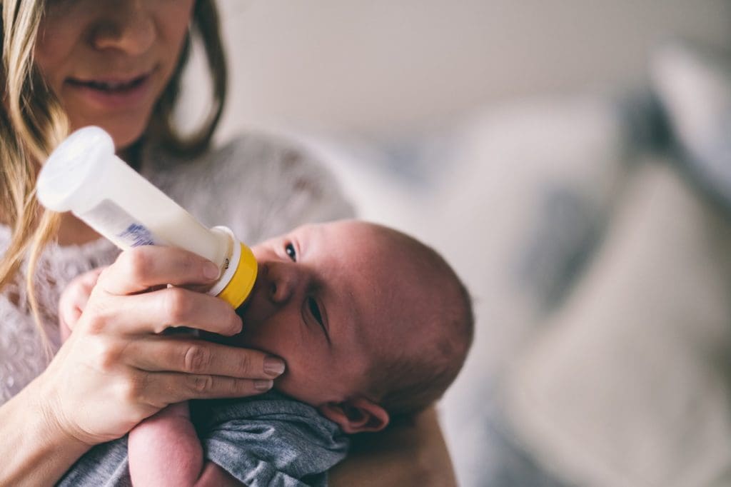 mom feeding baby