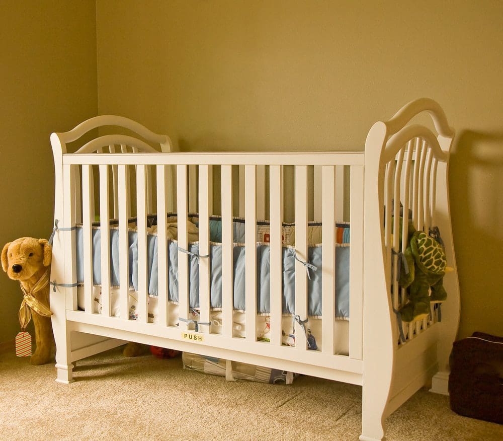 White Crib with Unsafe Crib Bumpers