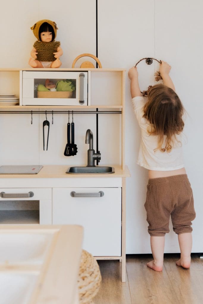 child cleaning room