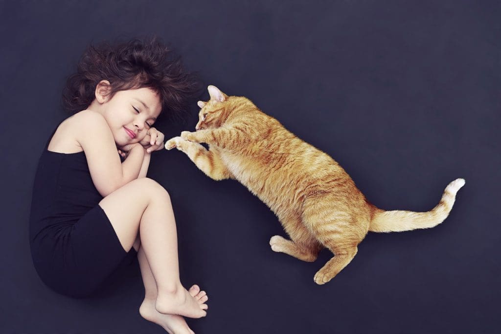 Girl sleeping with cat