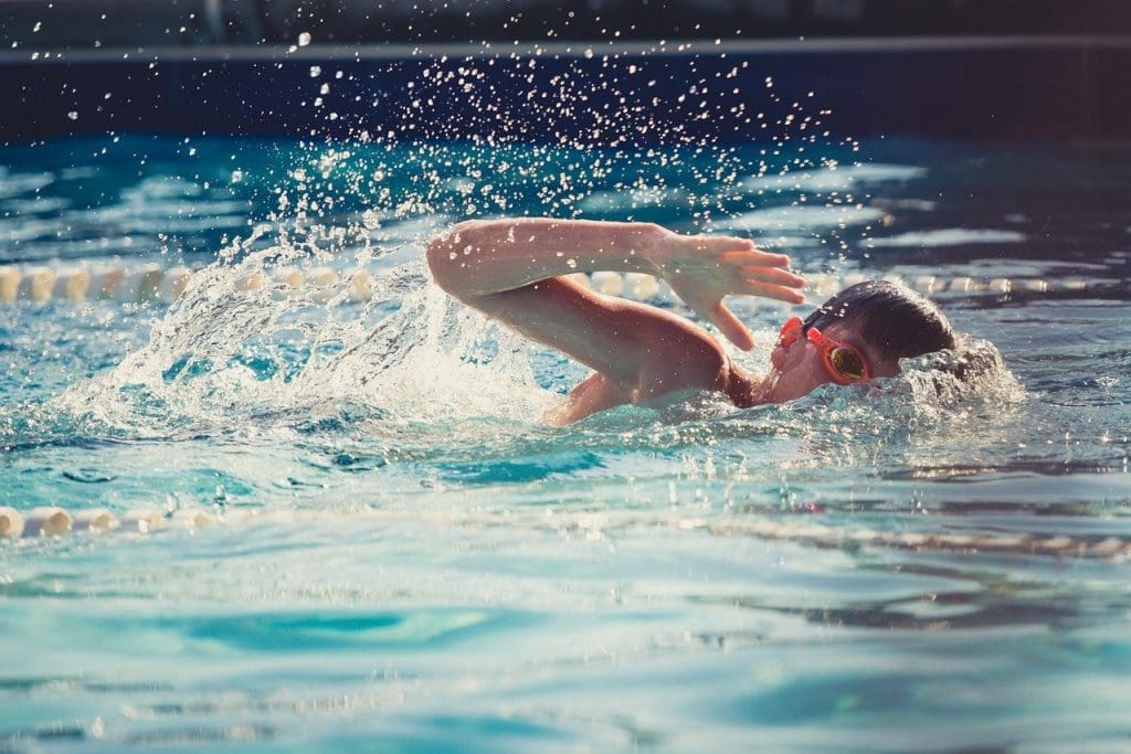 Boy swimming in pool