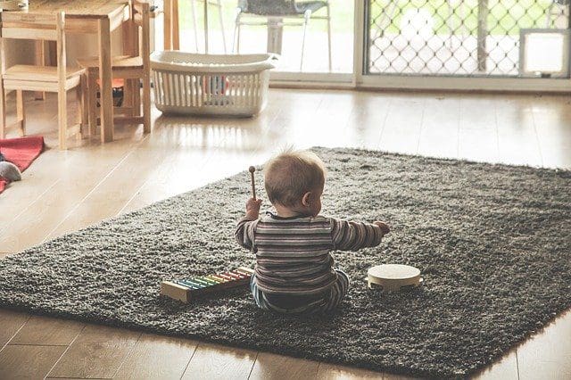 Toddler playing music