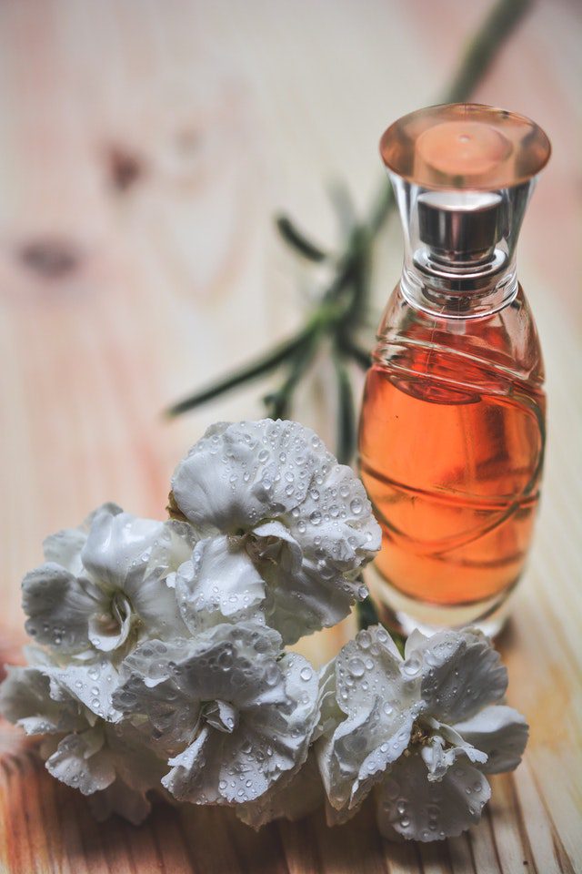 perfume bottle with flower